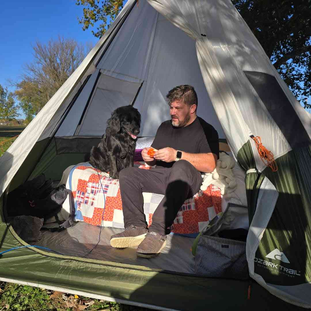 Leon L Smooth camping with his dog